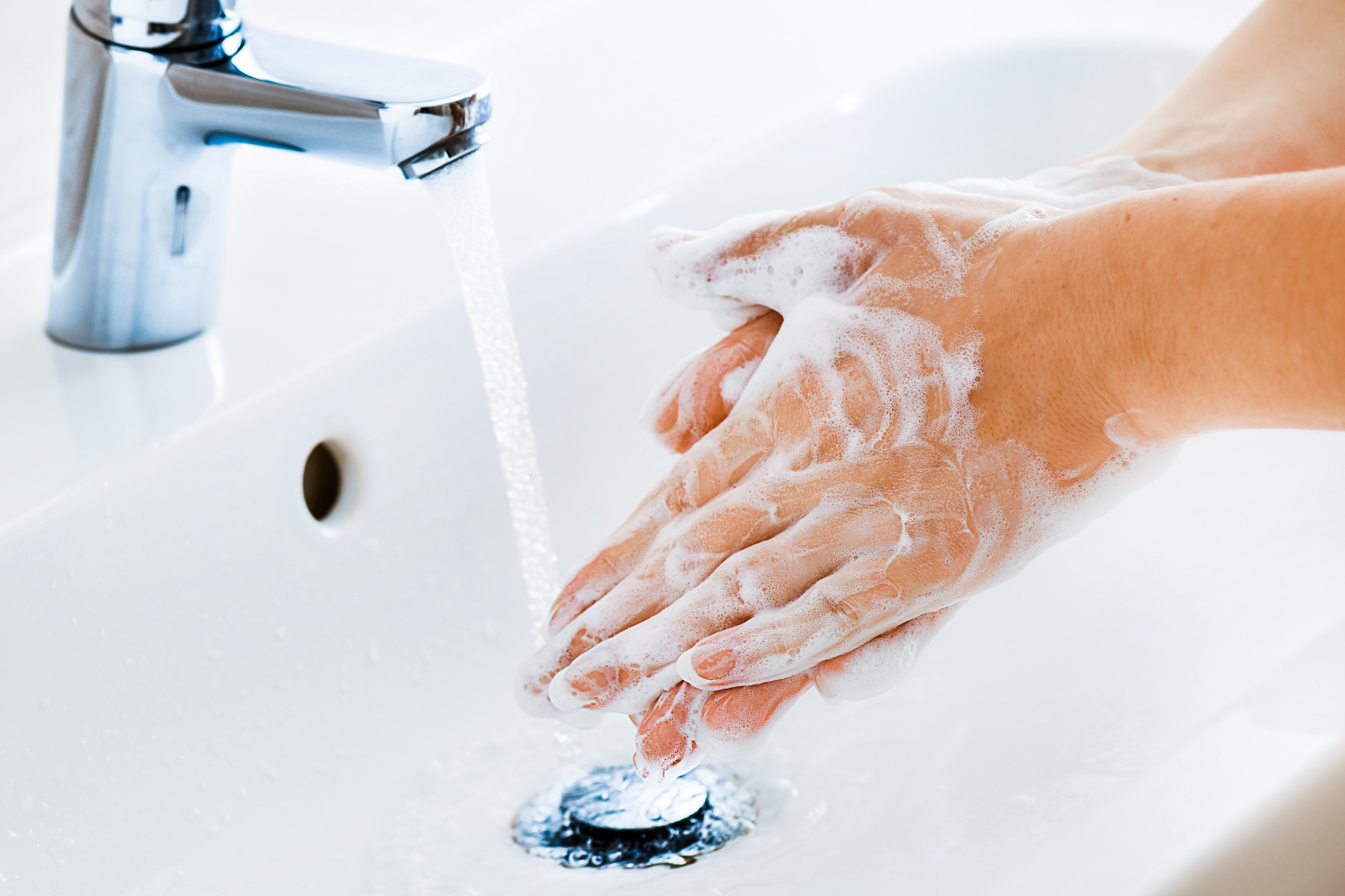 Woman use soap and washing hands