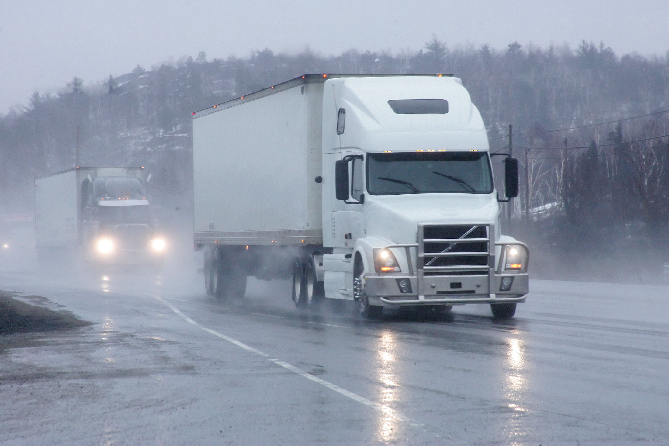 truck on highway in rain